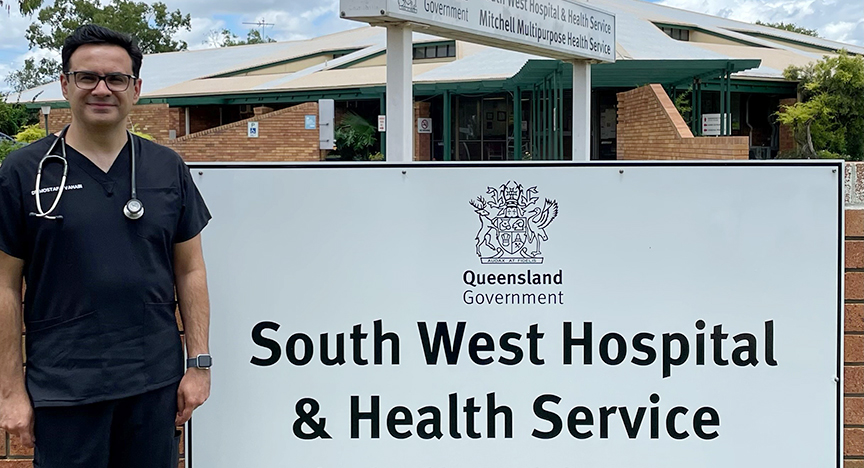 Mostafa VAHABI standing in front of a sign South West Hospital and Health Service